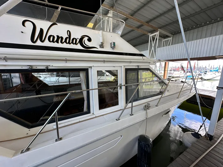  Yacht Photos Pics 1987 Ocean Alexander 46 Cockpit Motor Yacht docked in marina, side view.