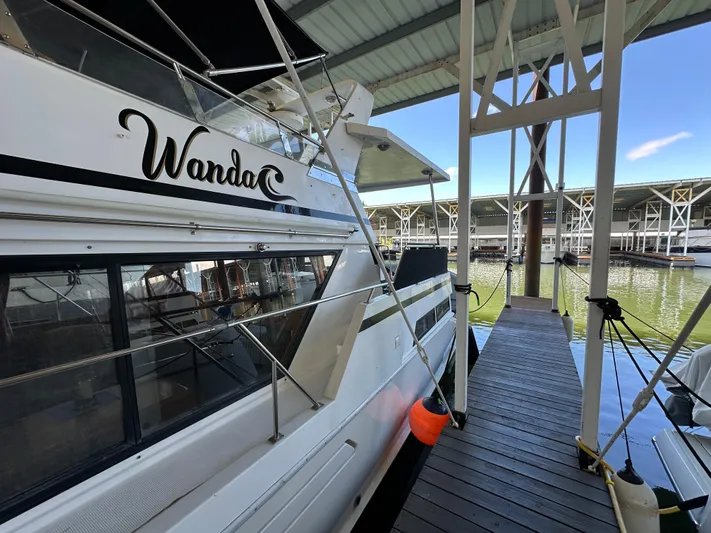  Yacht Photos Pics 1987 Ocean Alexander 46 Cockpit Motor Yacht docked in a marina.
