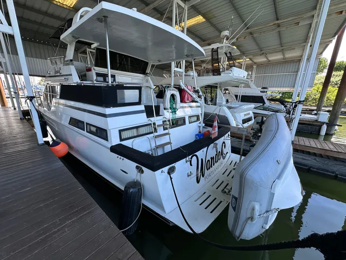  Yacht Photos Pics 1987 Ocean Alexander 46 Cockpit Motor Yacht docked in a covered marina.