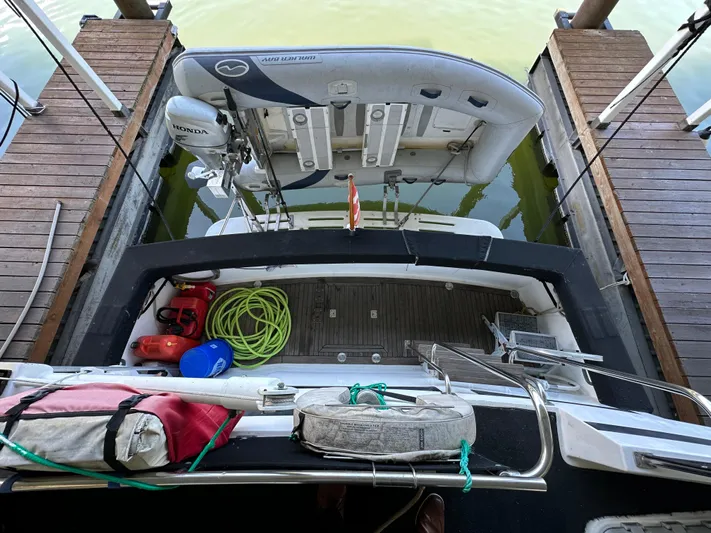  Yacht Photos Pics 1987 Ocean Alexander 46 Cockpit Motor Yacht docked with inflatable boat and equipment.