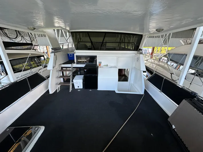  Yacht Photos Pics 1987 Ocean Alexander 46 Cockpit Motor Yacht interior with seating and storage.