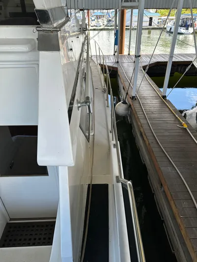  Yacht Photos Pics 1987 Ocean Alexander 46 Cockpit Motor Yacht docked in marina, side view.