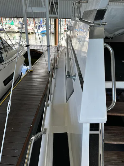  Yacht Photos Pics 1987 Ocean Alexander 46 Cockpit Motor Yacht docked in a marina, side view.