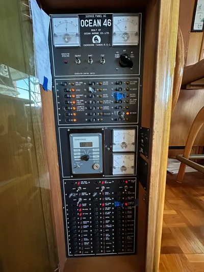  Yacht Photos Pics Control panel of a 1987 Ocean Alexander 46 Cockpit Motor Yacht, featuring various switches and gauges.
