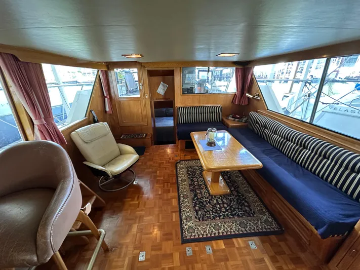  Yacht Photos Pics Interior of 1987 Ocean Alexander 46 Cockpit Motor Yacht with seating and table.