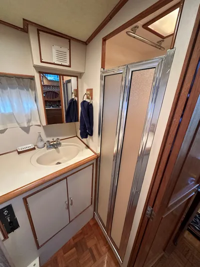  Yacht Photos Pics 1987 Ocean Alexander 46 Cockpit Motor Yacht bathroom with sink, mirror, and shower.