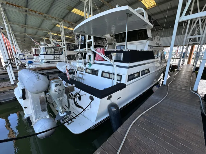  Yacht Photos Pics 1987 Ocean Alexander 46 Cockpit Motor Yacht docked in a marina.