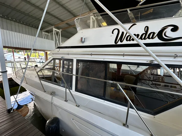  Yacht Photos Pics 1987 Ocean Alexander 46 Cockpit Motor Yacht docked in a covered marina.