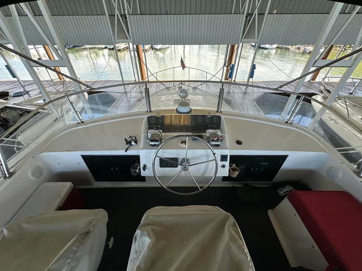  Yacht Photos Pics Cockpit view of 1987 Ocean Alexander 46 Cockpit Motor Yacht, featuring steering wheel and controls.