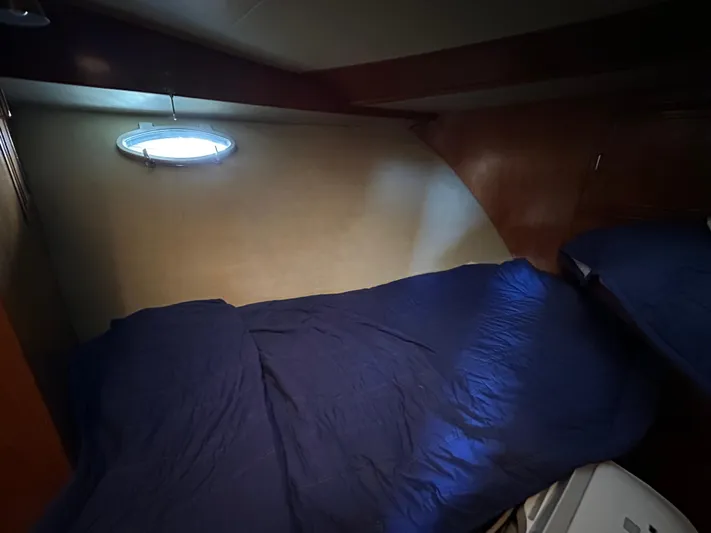  Yacht Photos Pics Cozy cabin interior of 1987 Ocean Alexander 46 Cockpit Motor Yacht with blue bedding.