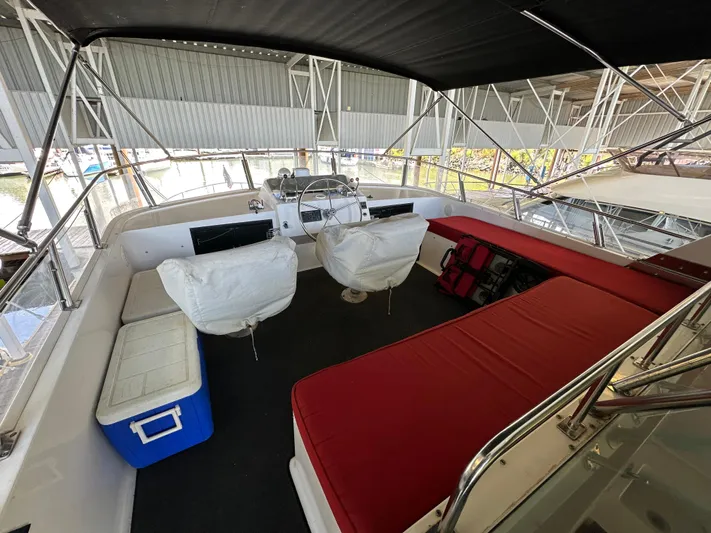  Yacht Photos Pics 1987 Ocean Alexander 46 Cockpit Motor Yacht interior with seating, helm, and storage.