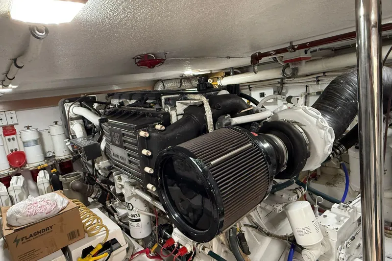 One Life Yacht Photos Pics Engine room of 2000 Hatteras 50 Convertible yacht, featuring a CAT marine engine.