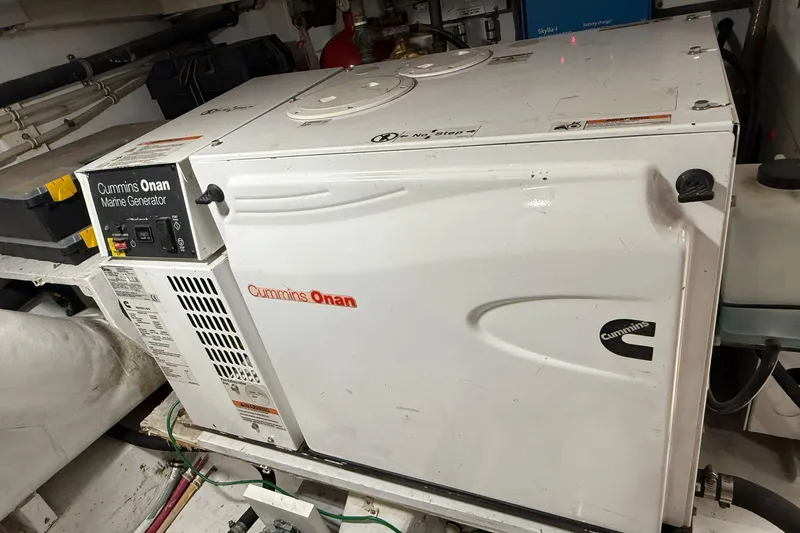 One Life Yacht Photos Pics Cummins Onan marine generator in a 2000 Hatteras 50 Convertible engine room.