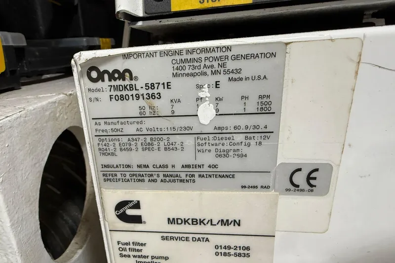 One Life Yacht Photos Pics Onan generator label on 2000 Hatteras 50 Convertible, detailing specifications and maintenance information.