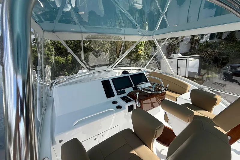 One Life Yacht Photos Pics Helm of 2000 Hatteras 50 Convertible yacht with modern controls and seating.