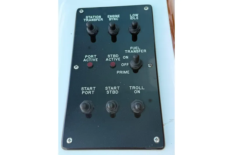 One Life Yacht Photos Pics Control panel of a 2000 Hatteras 50 Convertible boat with various switches.