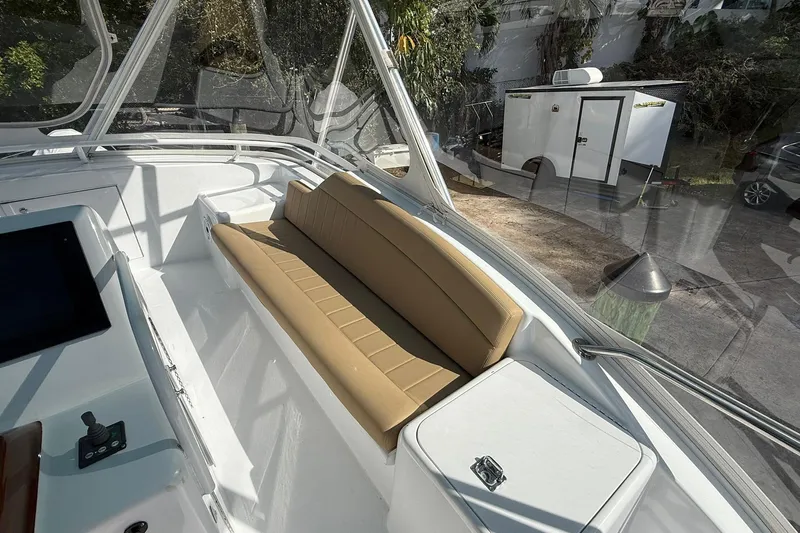 One Life Yacht Photos Pics 2000 Hatteras 50 Convertible yacht with tan seating and control panel.