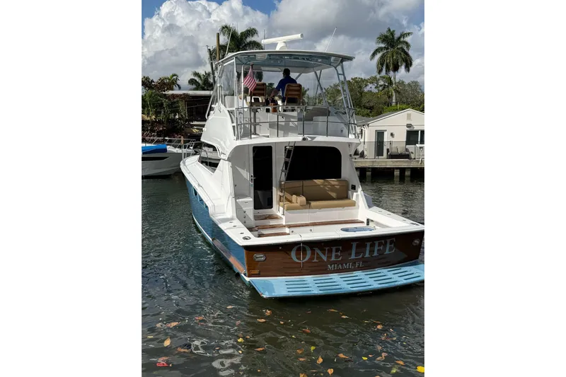 One Life Yacht Photos Pics Hatteras 50 Convertible yacht, 2000 model, docked in Miami, Florida, with "One Life" on the stern.