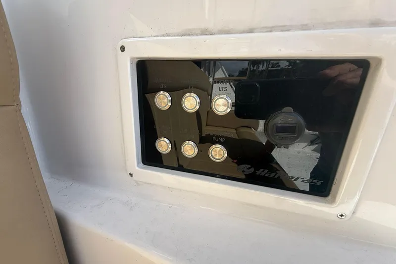 One Life Yacht Photos Pics Control panel on a 2000 Hatteras 50 Convertible yacht with labeled buttons.