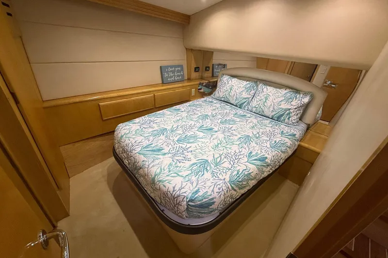 One Life Yacht Photos Pics Luxurious bedroom interior of 2000 Hatteras 50 Convertible yacht with elegant bedding.