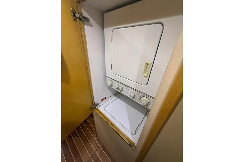 One Life Yacht Photos Pics Stacked washer and dryer in 2000 Hatteras 50 Convertible yacht.