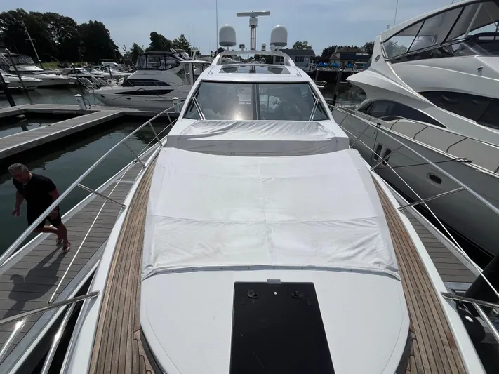 Penny Lane Yacht Photos Pics 2014 Azimut 55S yacht docked at marina, showcasing sleek design and spacious deck.