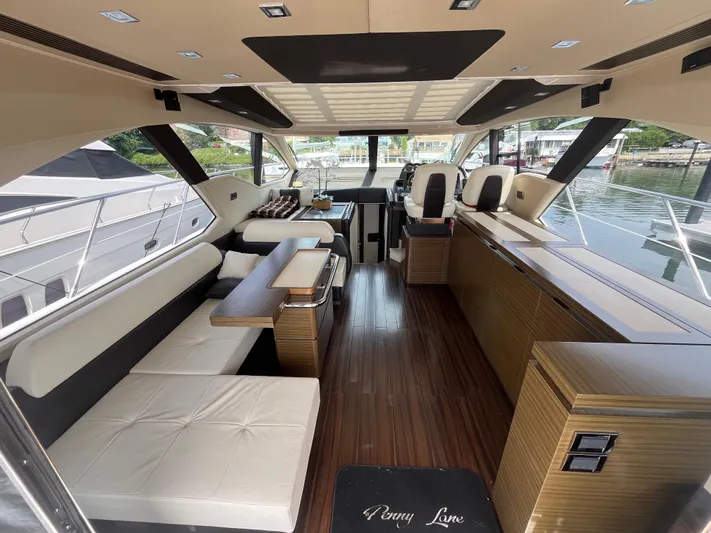 Penny Lane Yacht Photos Pics Luxurious interior of a 2014 Azimut 55S yacht with elegant seating and modern design.