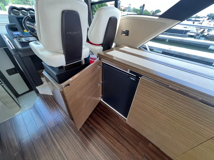Penny Lane Yacht Photos Pics Interior of 2014 Azimut 55S yacht with wood flooring and modern seating.