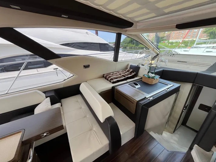 Penny Lane Yacht Photos Pics Luxurious interior of a 2014 Azimut 55S yacht with elegant seating and decor.