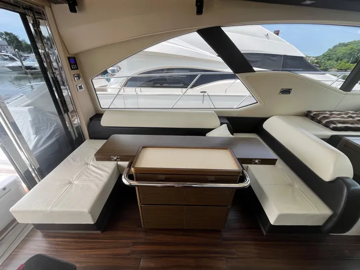 Penny Lane Yacht Photos Pics Interior of 2014 Azimut 55S yacht with elegant seating and wooden flooring.