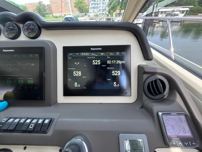 Penny Lane Yacht Photos Pics Control panel of a 2014 Azimut 55S yacht with Raymarine displays.