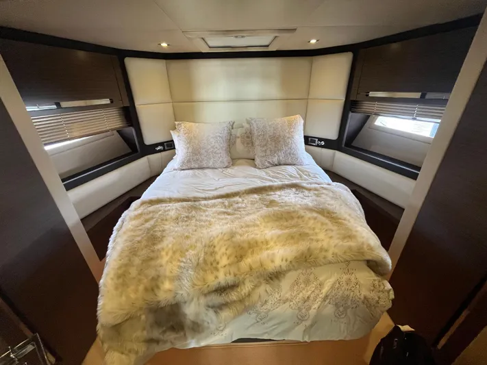 Penny Lane Yacht Photos Pics Luxurious bedroom interior of 2014 Azimut 55S yacht with plush bedding and modern design.