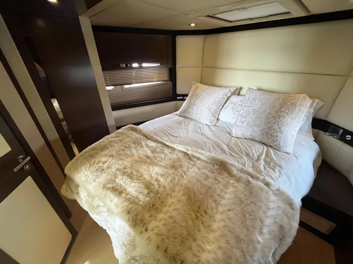 Penny Lane Yacht Photos Pics Luxurious bedroom interior of 2014 Azimut 55S yacht with plush bedding and elegant decor.