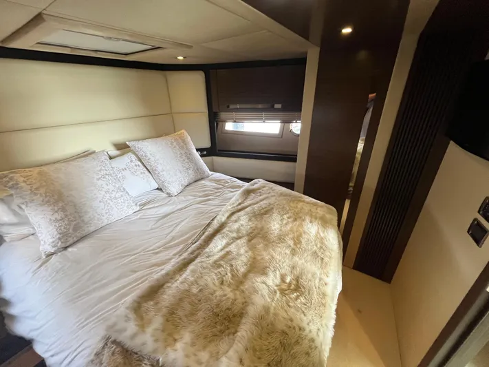 Penny Lane Yacht Photos Pics Luxurious bedroom interior of 2014 Azimut 55S yacht with plush bedding and elegant decor.