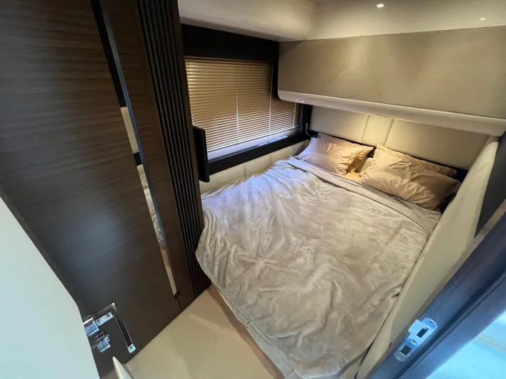 Penny Lane Yacht Photos Pics Luxurious bedroom interior of 2014 Azimut 55S yacht with cozy bedding and modern design.