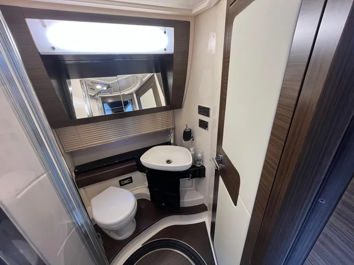 Penny Lane Yacht Photos Pics Luxurious bathroom interior of 2014 Azimut 55S yacht with modern fixtures and elegant design.