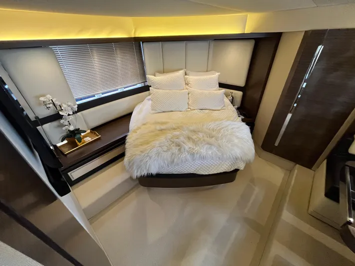 Penny Lane Yacht Photos Pics Luxurious bedroom interior of 2014 Azimut 55S yacht with plush bedding and elegant decor.