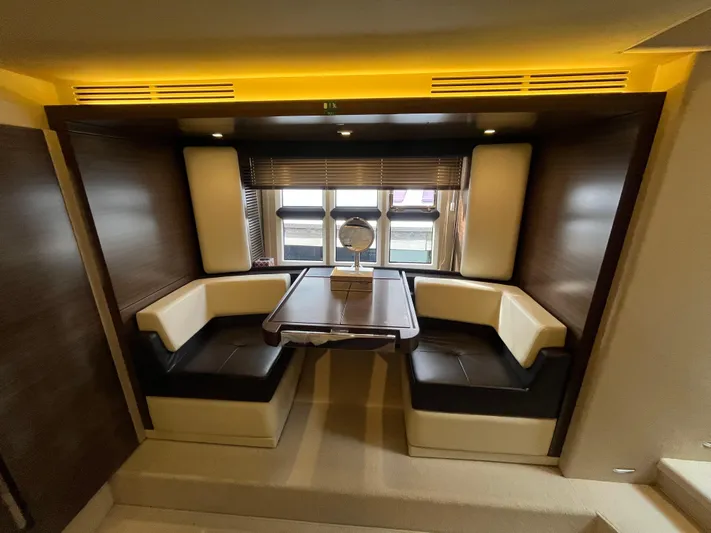 Penny Lane Yacht Photos Pics Luxurious interior of 2014 Azimut 55S yacht with elegant seating and table.