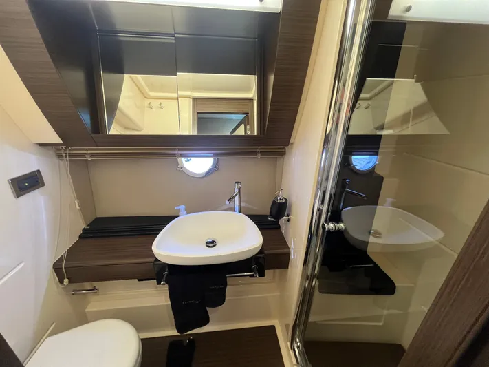 Penny Lane Yacht Photos Pics Luxurious bathroom interior of 2014 Azimut 55S yacht with modern fixtures and elegant design.