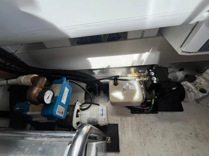 Penny Lane Yacht Photos Pics Engine room of a 2014 Azimut 55S yacht, showcasing mechanical components and equipment.