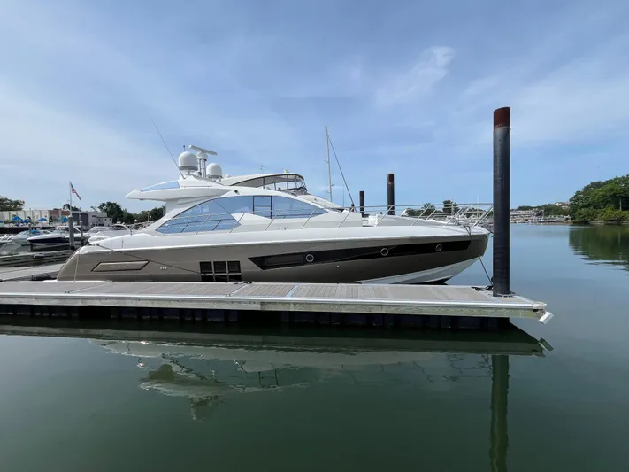 Penny Lane Yacht Photos Pics 2014 Azimut 55S yacht docked at marina, calm water, clear sky.