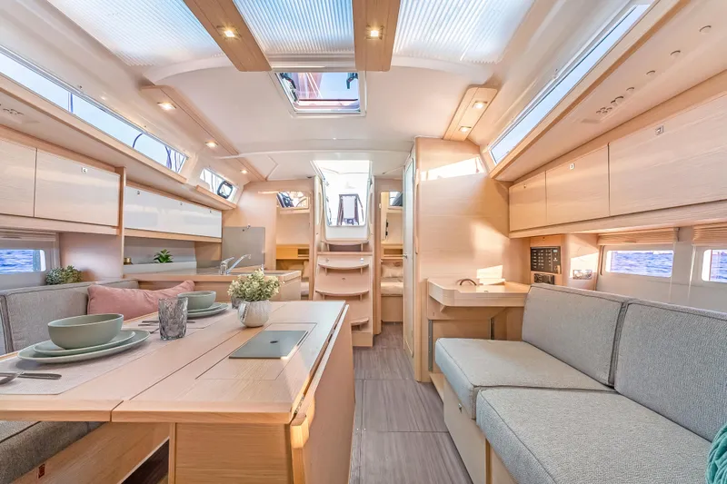 In Stock #325 Yacht Photos Pics Interior of 2023 Dufour 390 yacht, featuring modern design and spacious seating area.