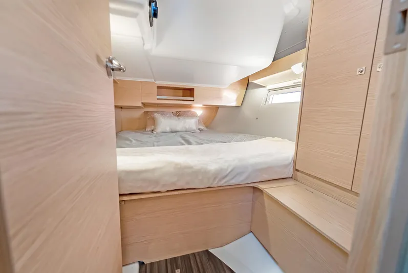 In Stock #325 Yacht Photos Pics Cozy cabin interior of 2023 Dufour 390 yacht with modern wood finish.