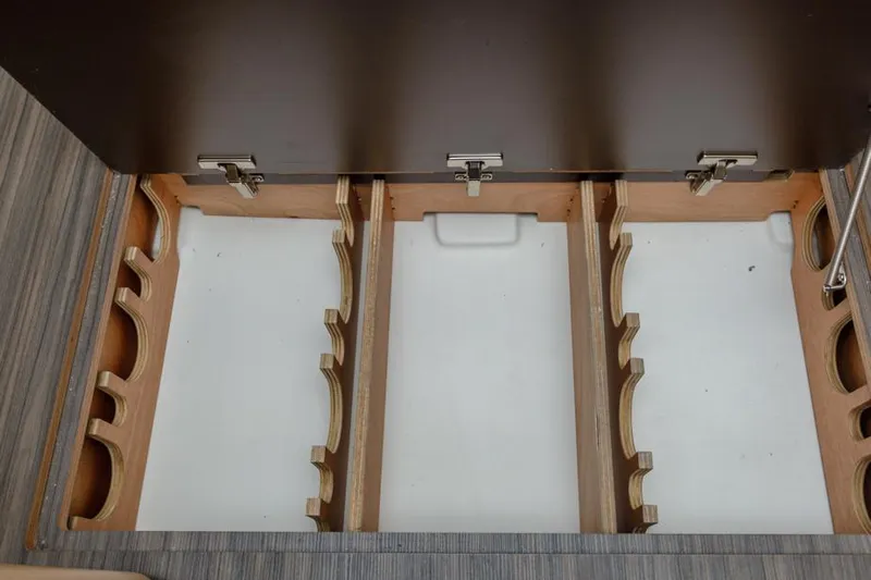 In Stock #325 Yacht Photos Pics Dufour 390 2023 yacht interior storage compartments with wooden dividers.