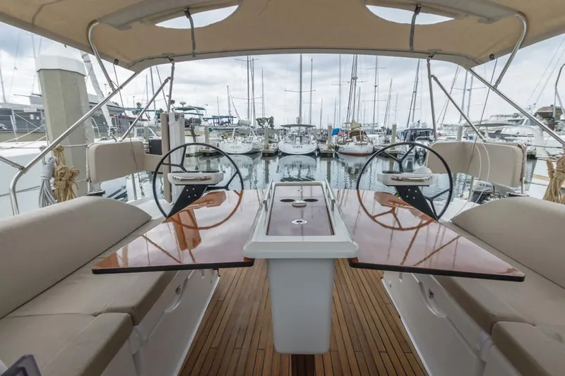 In Stock #325 Yacht Photos Pics Dufour 390 yacht cockpit with dual steering wheels, 2023 model, docked at marina.