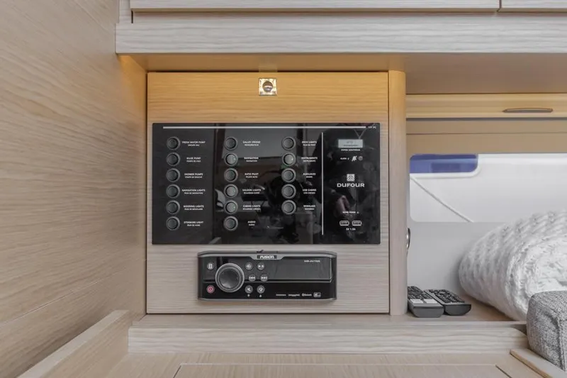 In Stock #325 Yacht Photos Pics Control panel of 2023 Dufour 390 yacht, featuring modern navigation and communication systems.