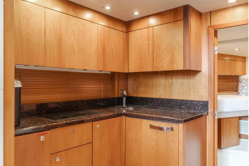 Tranquility Yacht Photos Pics Luxurious wooden kitchen interior of 2012 Sunseeker Portofino 48 yacht.