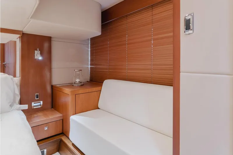 Tranquility Yacht Photos Pics Interior of 2012 Sunseeker Portofino 48 yacht with modern seating and wooden accents.