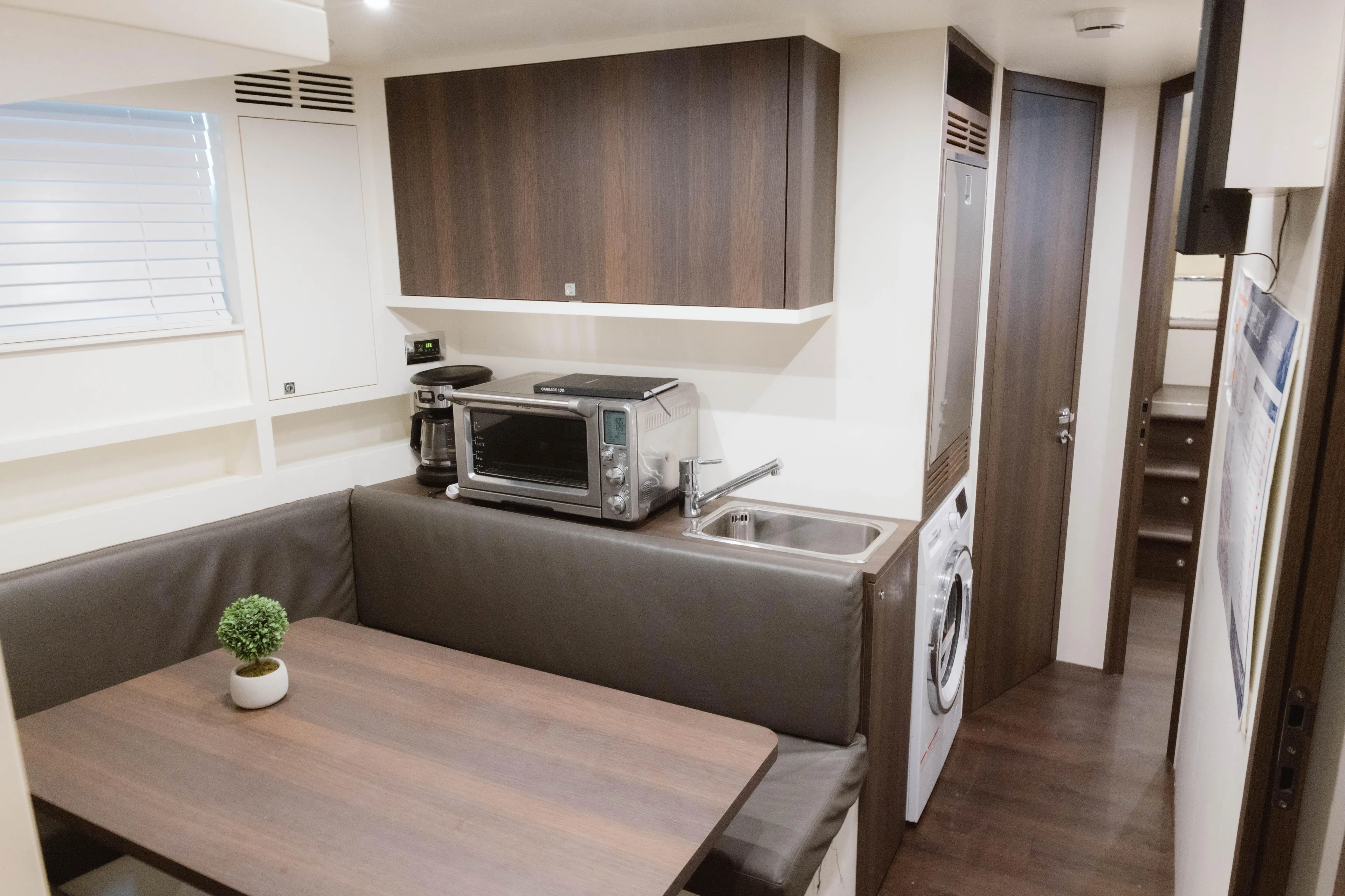 Carpe Diem Yacht Photos Pics Luxurious interior of 2023 Azimut 32M Grande yacht with modern kitchen and dining area.