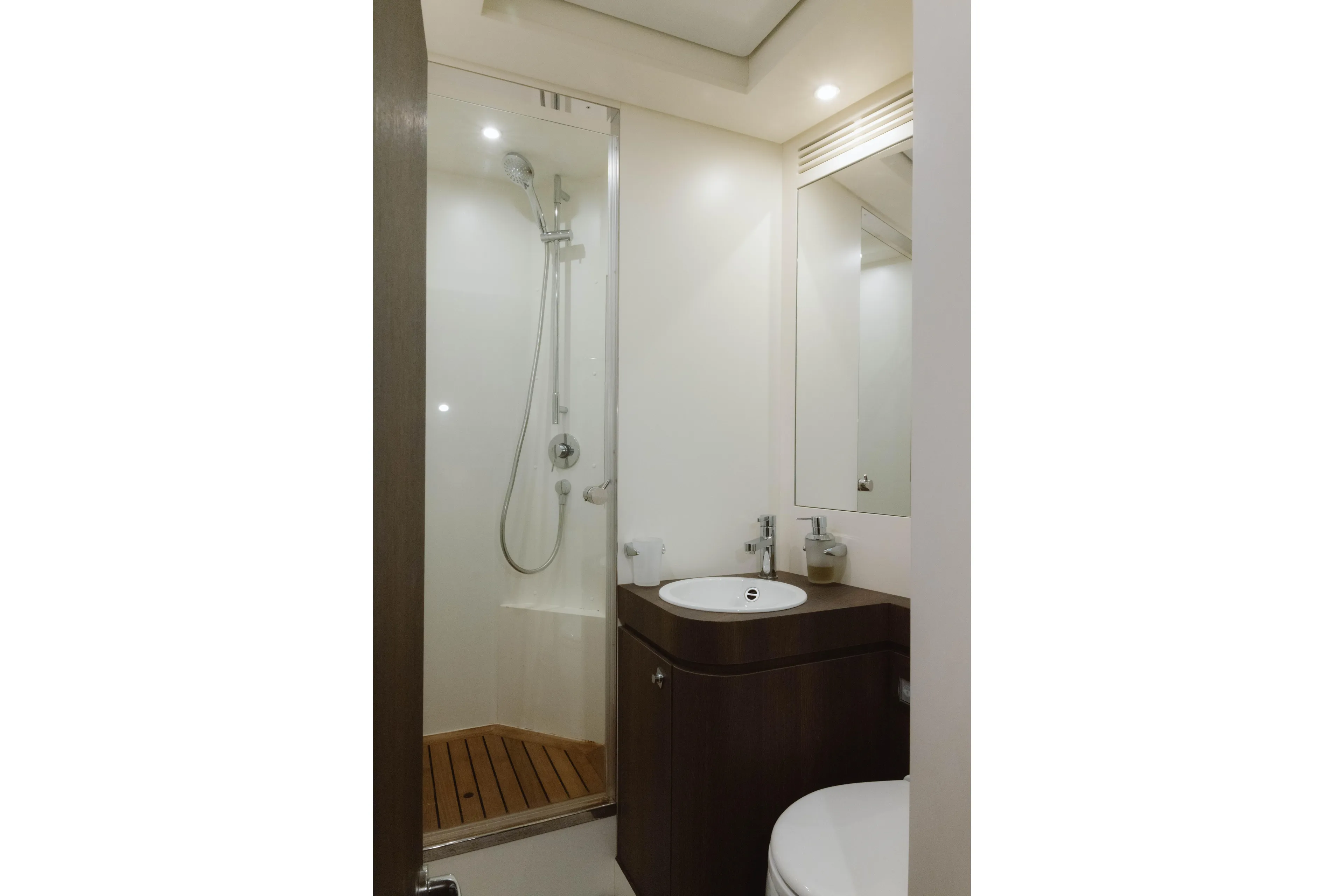 Carpe Diem Yacht Photos Pics Luxurious bathroom in 2023 Azimut 32M Grande yacht, featuring modern shower and sleek vanity.